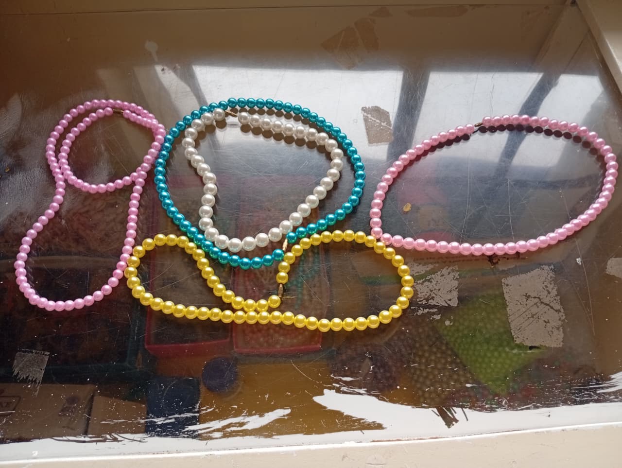 Handmade beaded necklaces by students
